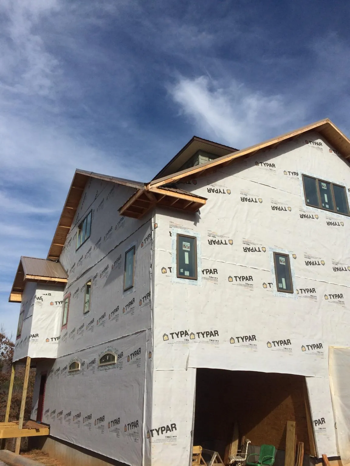 Stick built house wrapped in Typar with new roof framing and dormers in Ransom